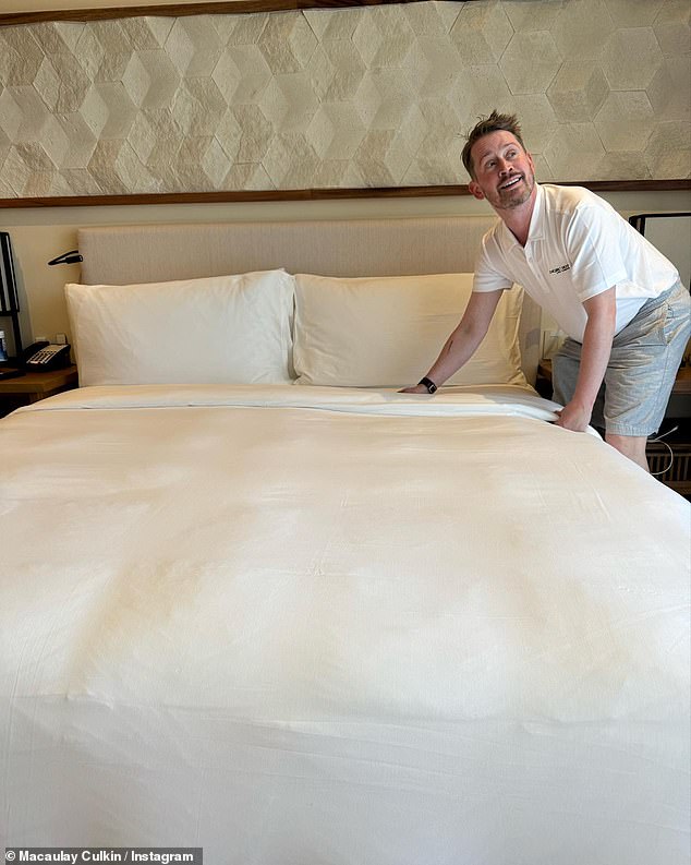 The Home Alone alum was seen making a bed in another shot of the slideshow.