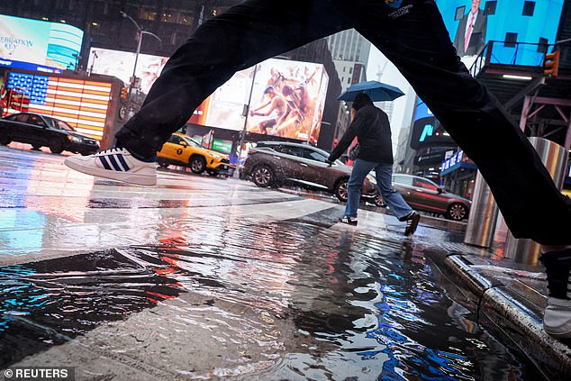 Puddles of water lined the streets of New York City as people tried to avoid the wet, rainy weather Wednesday night.
