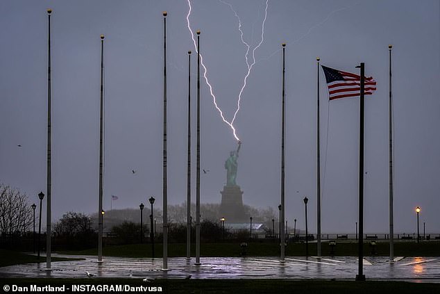 Three lightning bolts lit up the sky as they hit the Statue of Liberty during Northeastern Easter