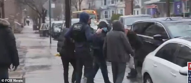 The raid initially resulted in eight arrests and police suspect the immigrants were illegally occupying the property.