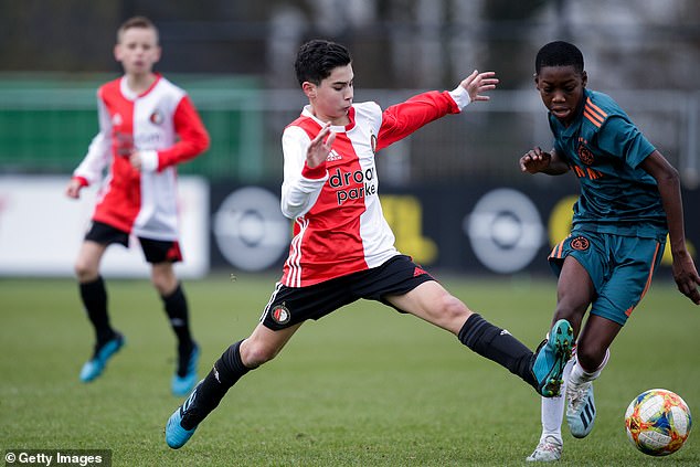 Shaqueel van Persie (left) in action with the Feyenoord U14 team against Ajax in 2019