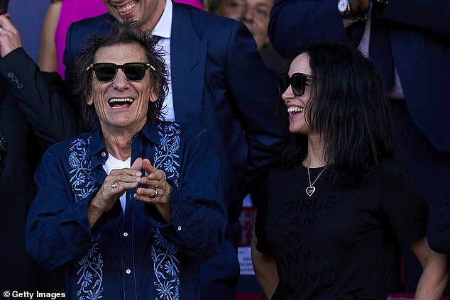 Ronnie Woods and his wife Sally at a soccer match between Barcelona and Real Madrid