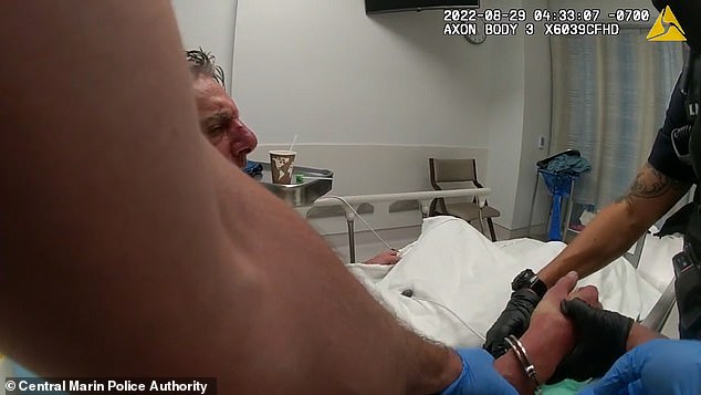 Frankel appears in police body camera footage expressing disbelief while handcuffed in his hospital bed.