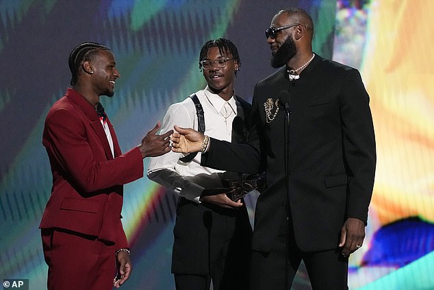 Bryce (center) is pictured with his brother Bronny and father LeBron James at the ESPY Awards.