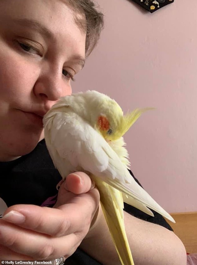 LeGresley is pictured here with one of her two cockatoos, Chancey and Princess Pea.