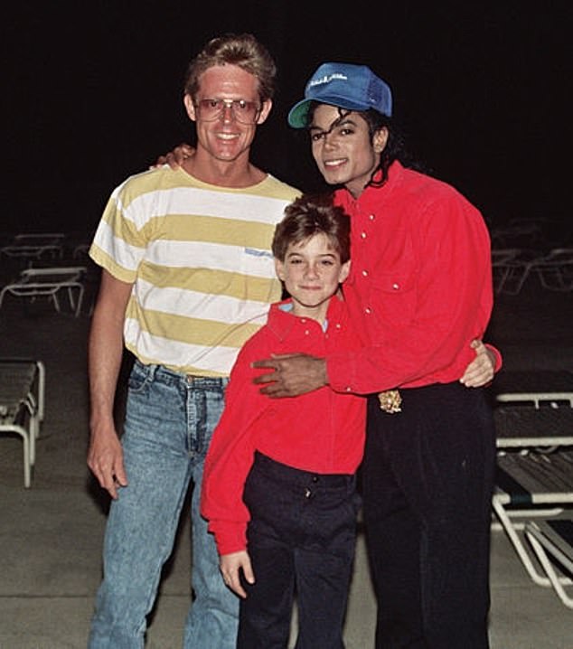 Wade Robson (pictured with Jackson and an unidentified man) claimed that Jackson sexually abused him as a child at his Neverland ranch and elsewhere.