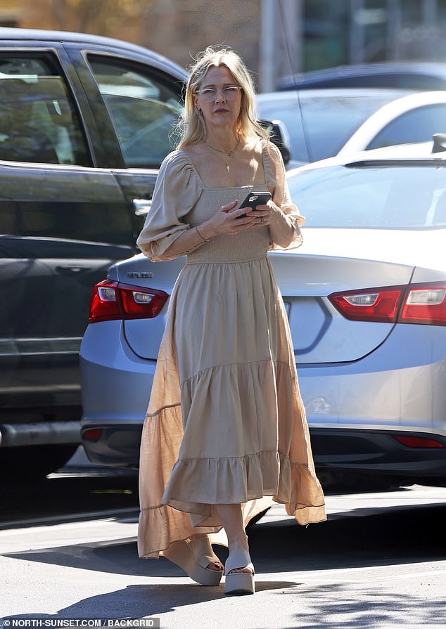The Beverly Hills, 90210 star wore a beige summer maxi dress with puffed sleeves, which she paired with matching platform sandals