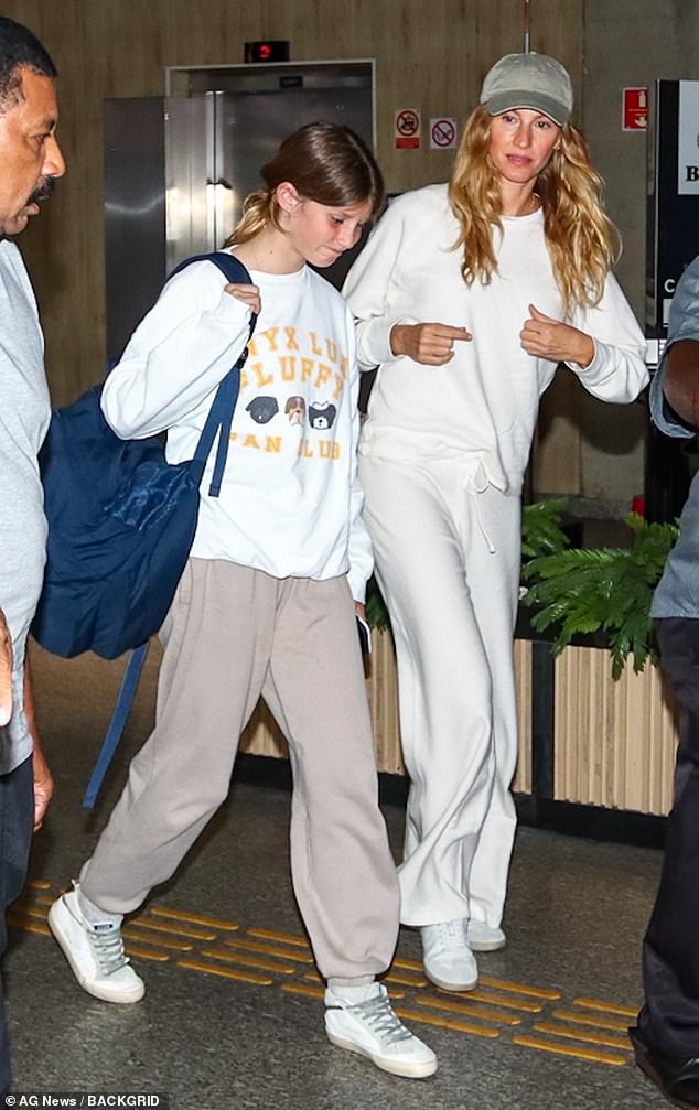 The supermodel, 43, was spotted wearing a cream underwear set with white and light green sneakers while traveling with her 11-year-old daughter.