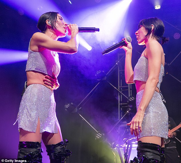 The pop star sisters dazzled the screaming crowd when they stepped out in sparkly silver miniskirts and crop tops.