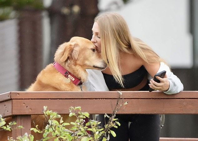 She was seen sweetly kissing her dog Cub on the head while pampering him during the outing.