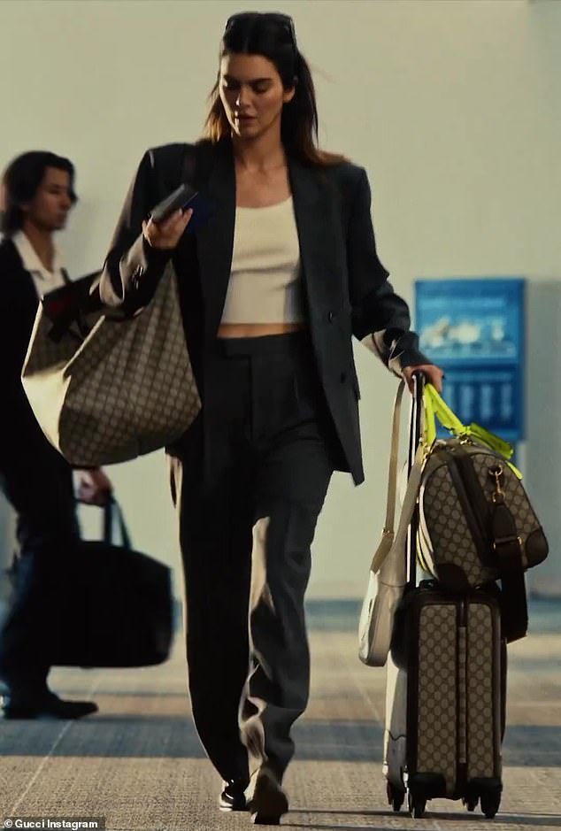 The 28-year-old supermodel was filmed running through a commercial airport while carrying her own luggage which included a rolling suitcase, a duffel bag, a shoulder bag and a purse.