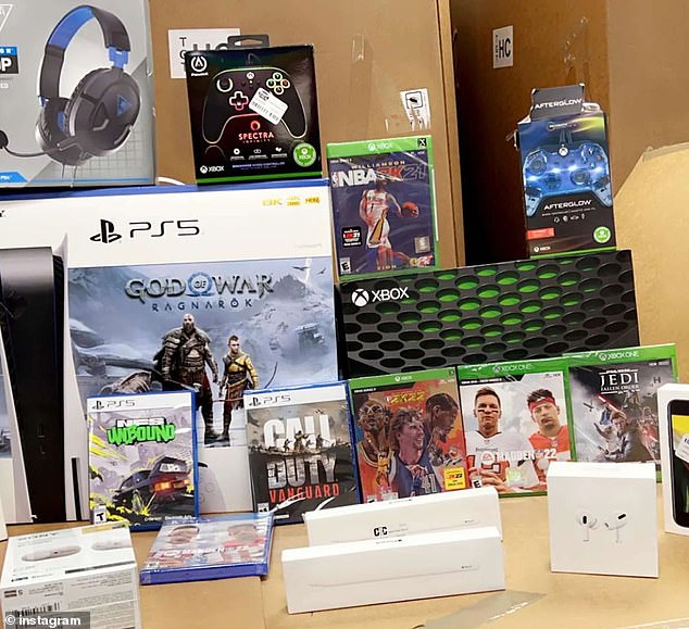 A stack with an Xbox console, a PS5, numerous games, controllers, headphones, Apple pencils and AirPods was displayed in the bargain store.