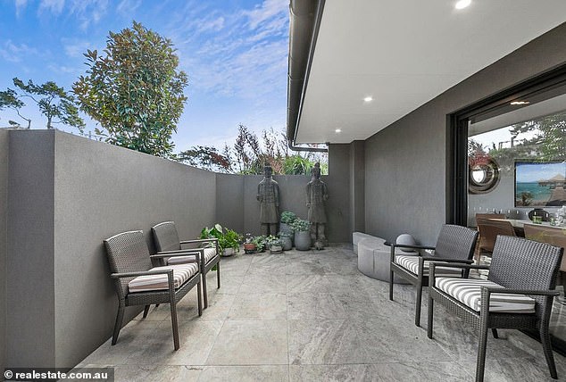 One of the outside areas of the fully furnished Balgowlah unit (pictured)