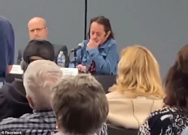 At one point during the meeting, an audience member yelled at Winter for scrolling on her phone while people shared their concerns.