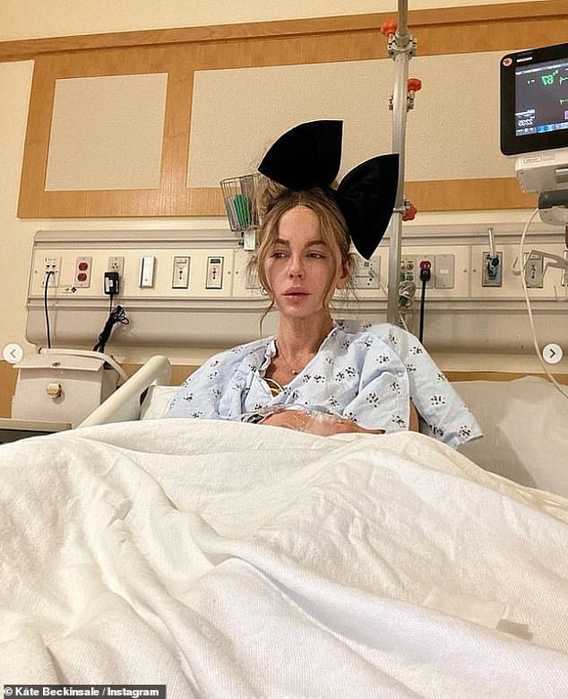 Kate Beckinsale sparked concern again by sharing selfies from a hospital bed on Saturday night.