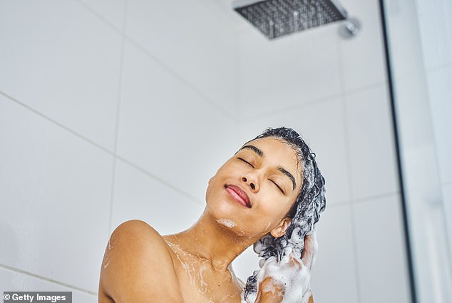 According to an expert, hair care ingredients stain pillowcases and contaminate sheets and towels, which can cause acne (file image)