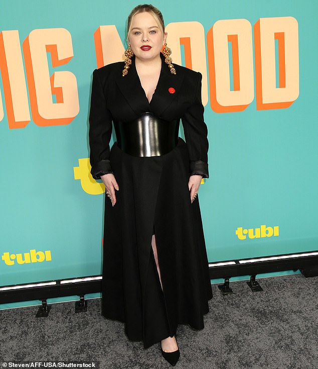 Earlier in the day, she turned heads again in a black dress with shoulder pads and a shiny black corset-style belt while attending the US premiere of Big Mouth.
