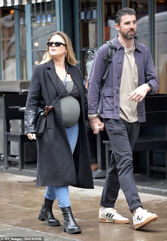 The TV personality who is expecting her first child with the nuclear scientist, showed off her burgeoning baby bump as she nears her due date.