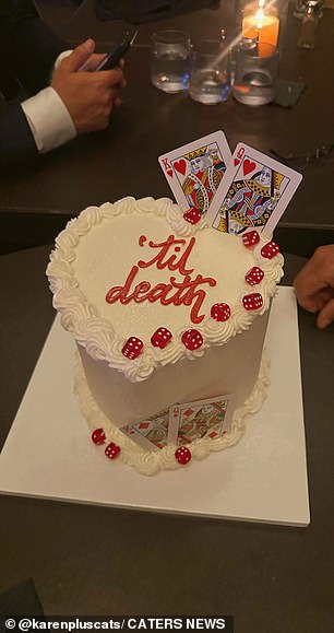 The couple's custom wedding cake cost $155 and was decorated with dice and playing cards.