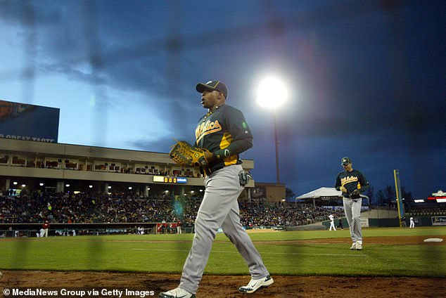 Yoenis Céspedes (52) returns to the dugout during a 2012 exhibition in Sacramento