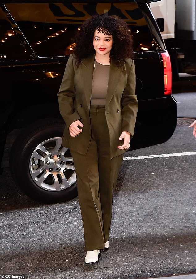 The It's A Sin star donned a loose-fitting khaki suit with a racer-neck top underneath.