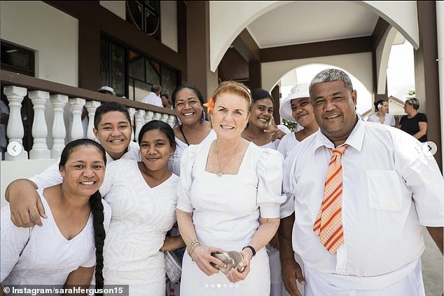 Dressed in white, the Duchess looks delighted as she is photographed meeting more locals in Samoa.