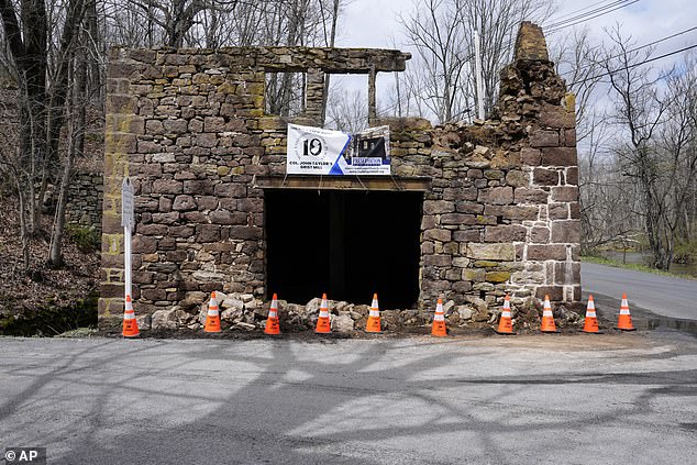 Cones cordon off the fallen rubble of the historic Taylor's Mill in Lebanon, New Jersey, on Friday.  The United States Geological Survey reported an earthquake at 10:23 a.m. with a preliminary magnitude of 4.8, with the epicenter near Whitehouse Station, 45 miles west of New York City and 50 miles north of Philadelphia.