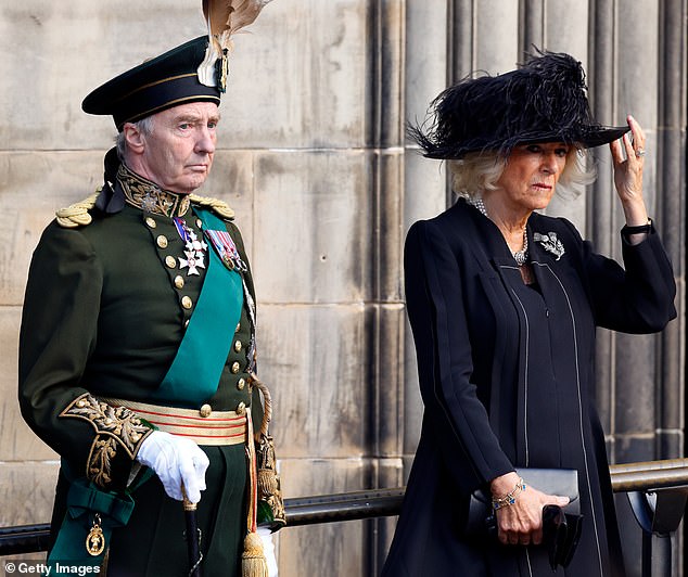 Richard Scott, 10th Duke of Buccleuch, pictured with Queen Camilla, is the son of Johnny, the Earl of Dalkeith, who is said to have had a daughter in 1939 when he was 15 years old.