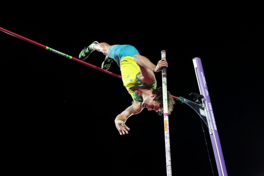 Kurtis Marschall jumps over the bar as shown from below.