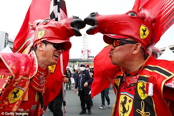 SUZUKA, JAPAN - APRIL 6: A pair of Ferrari fans show their support with horse hats before qualifying for the Japanese F1 Grand Prix at the Suzuka International Racing Course on April 6, 2024 in Suzuka, Japan. (Photo by Peter Fox/Getty Images)