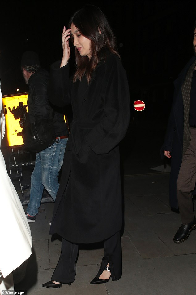 Lily was joined at her party by Gemma Chan, who donned a black trench coat which she wore over trousers and matching stilettos.