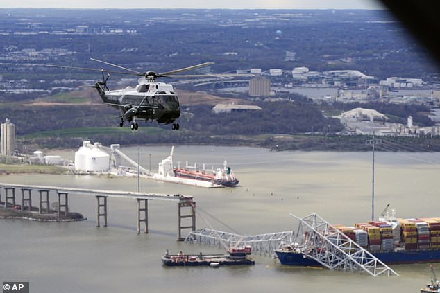 President Joe Biden, in Marine One, flies over the remains of the Francis Scott Key Bridge