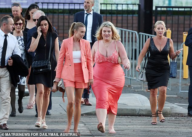 As well as the black and white outfit, salmon pink was also popular in Randwick on Saturday.