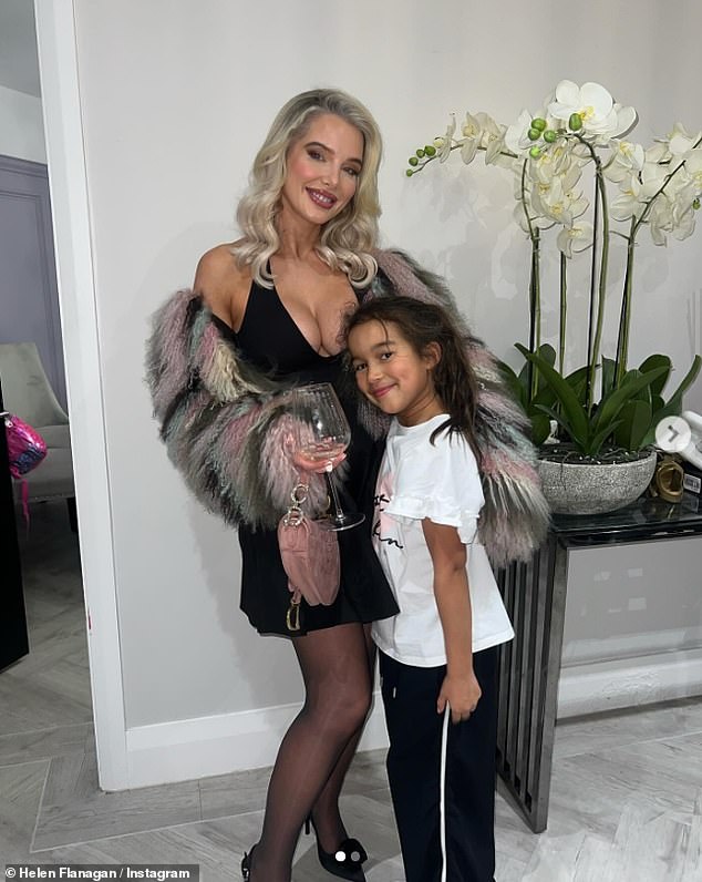 Helen revealed her entire look in a snap with her eldest daughter Matilda on her Instagram, as she teamed her daring dress with black tights, heels and a gray striped fur shawl.