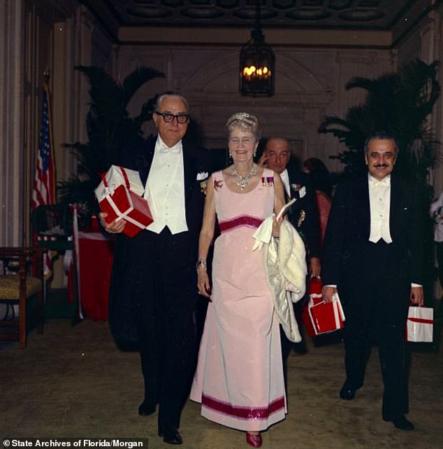 Marjorie Merriweather Post (right) appears in a snapshot of Bert Morgan reigning over a Red Cross ball at the world-famous luxury hotel The Breakers.