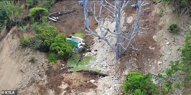 Horrifying drone images show the aftermath of the landslide with houses teetering on the edge of steep cliffs.