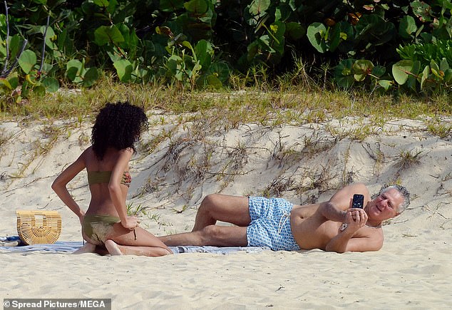 The couple isn't the only ones enjoying the white sand beaches of St. Barts.
