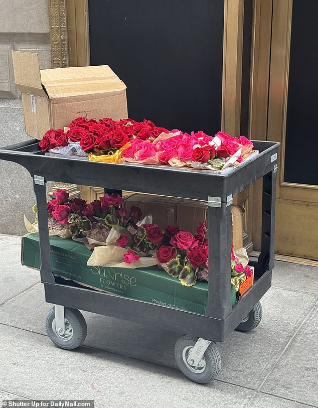 Boxes of pink and red roses were seen arriving at the reception venue.