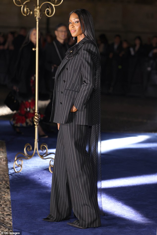 Naomi Campbell looked elegant in a striped suit