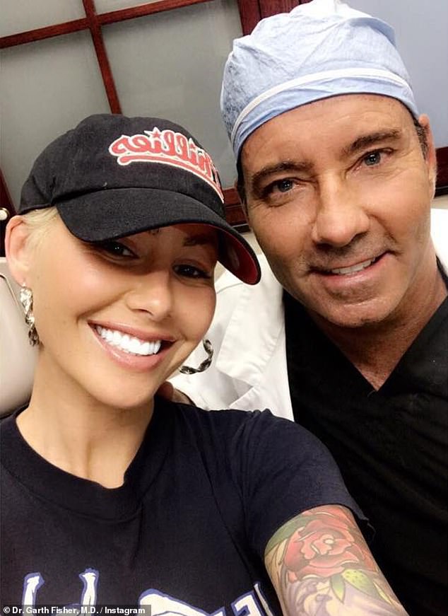 Dr. Fisher is pictured with Amber Rose, on whom he performed a breast reduction.