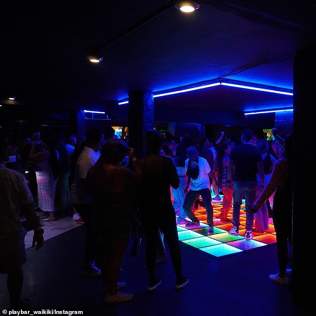 Martin arrived at the Playbar nightclub (pictured) in Waikiki in the early hours of Saturday morning and used her badge to let her and a friend inside.