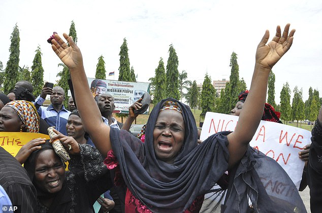 An unidentified mother shouts during a demonstration with others who have daughters among the girls abducted from Chibok Government Secondary School in 2014.