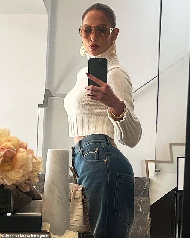 The On The Floor hitmaker showed off her effortless style in a cropped white turtleneck sweater and high-waisted jeans in snaps posted to her Instagram.
