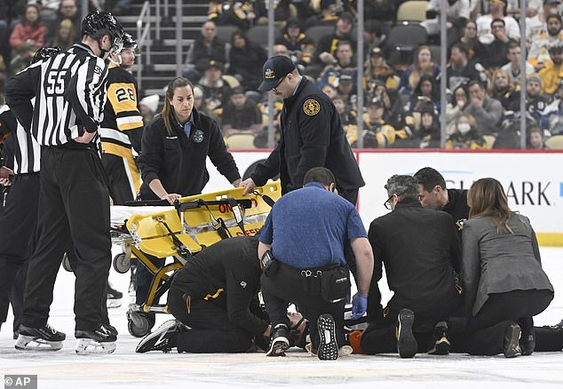 The referee had to be taken off the ice on a stretcher after the fall in the third period.