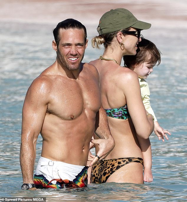 The podcaster and television personality, 38, enjoyed a dip in the sea with Spencer and their children.