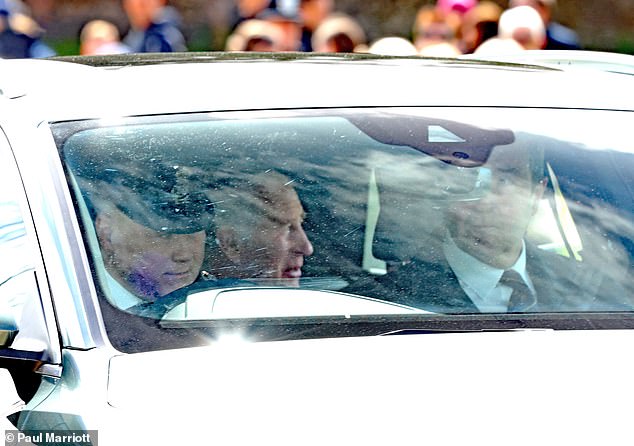 The 75-year-old monarch appeared to be in good spirits as he smiled in the back seat of a car passing by spectators.