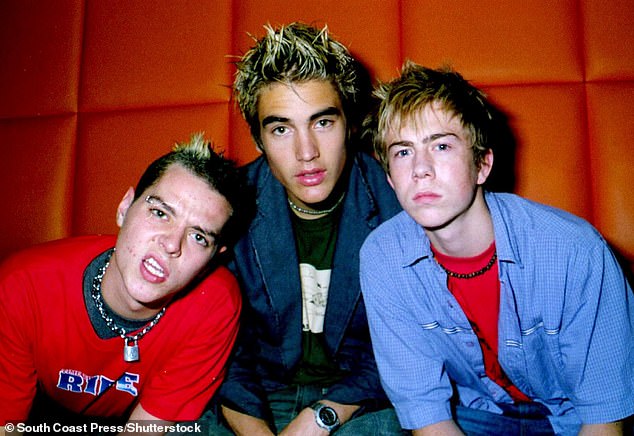 Willis continues to tour with the band that made him famous, with gigs planned across the UK this summer (pictured left to right: Busted members Matt Willis, Charlie Simpson and James Bourne in 2002)