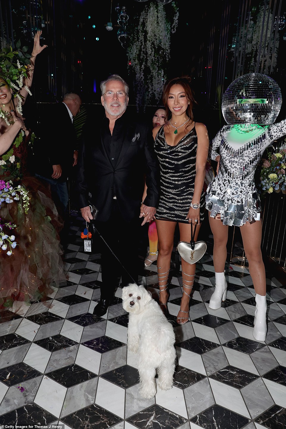 Thomas and Evelin are pictured making their grand entrance with their dog Tito.