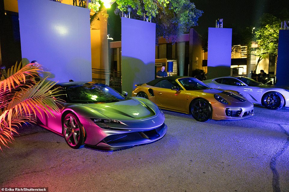 Six of Thomas's Ferraris, Porsches and Lamborghinis from his personal collection lined the outside of the club.