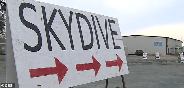 A sign directs drivers along California Highway 99 to the skydiving company's facilities.